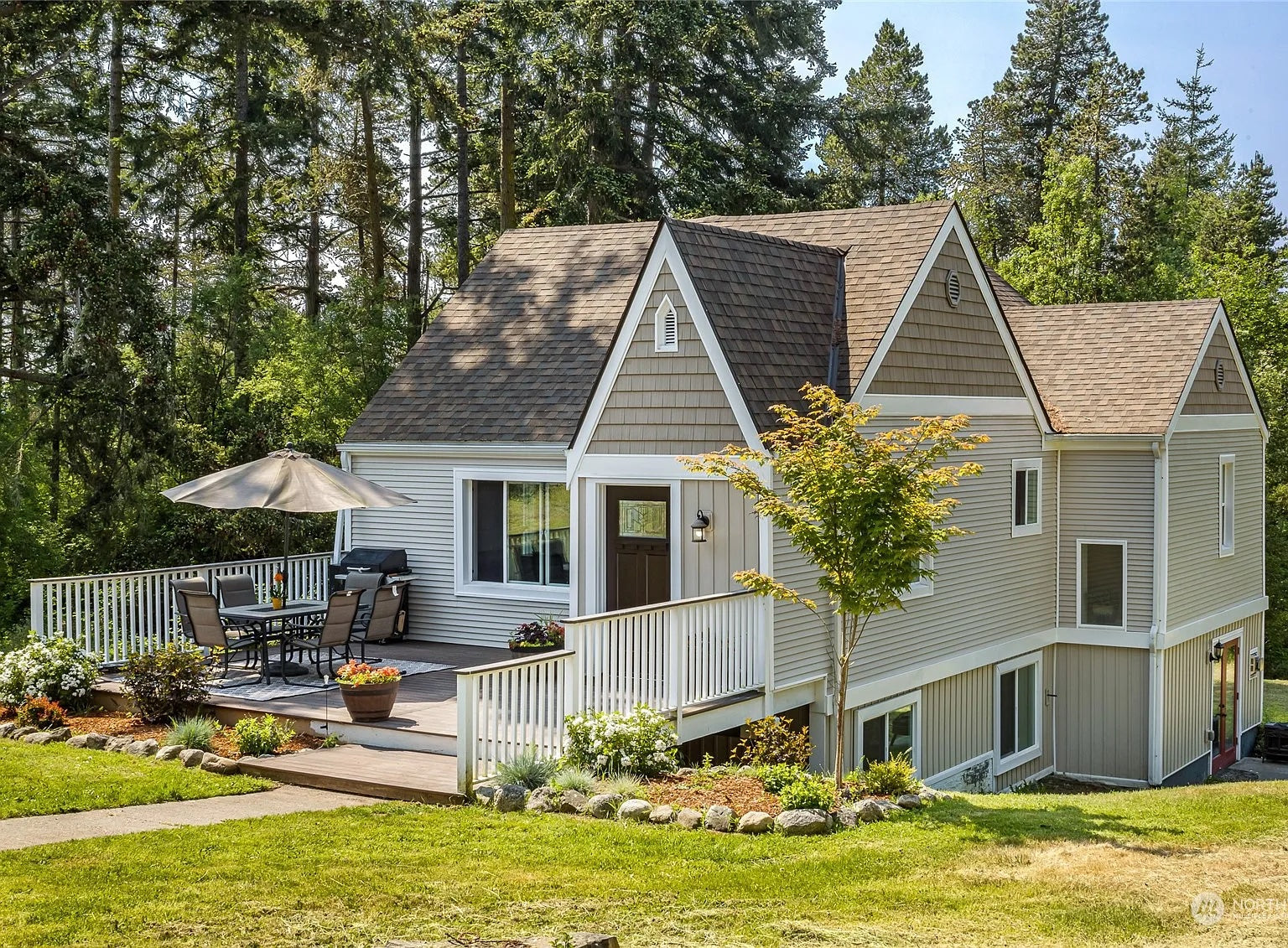 Charming tudor style Friday Harbor vacation rental with towering trees on San Juan Island.