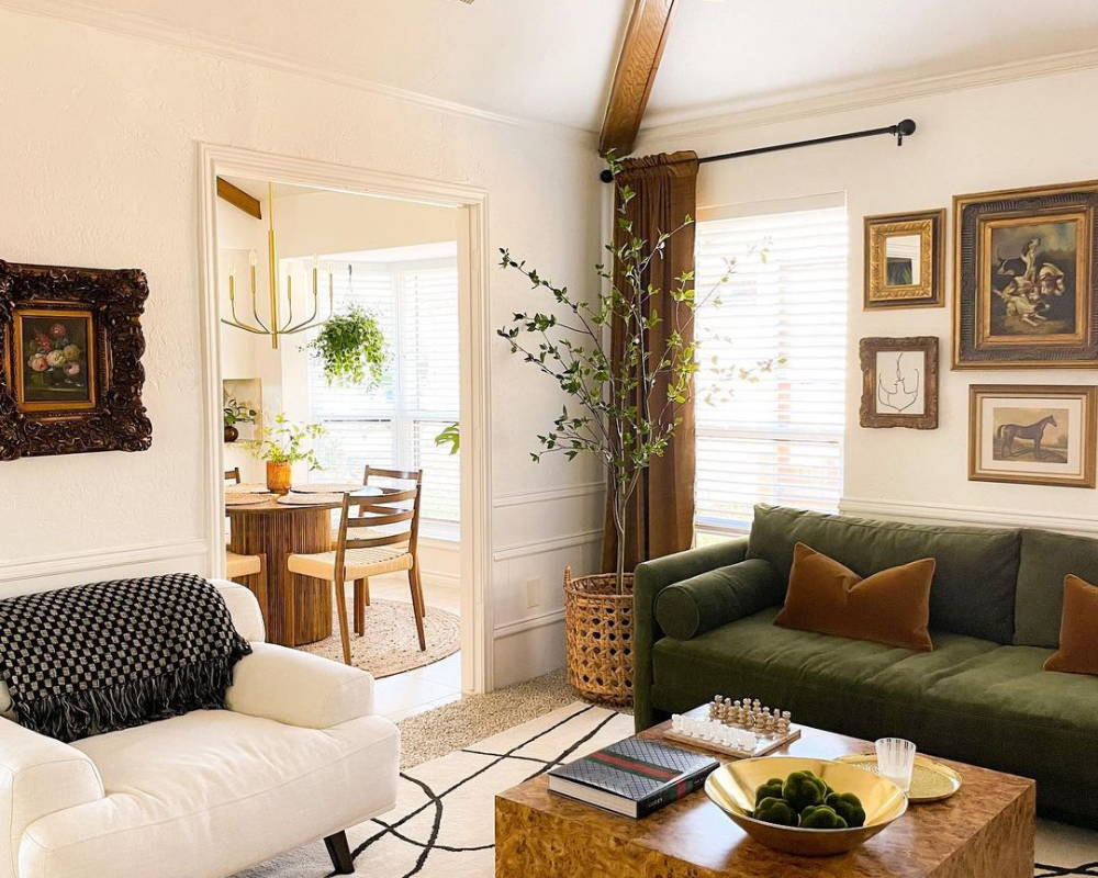 Charming living room with a chess board on the coffee table and a view of the kitchen in the background, creating a cozy and inviting atmosphere.
